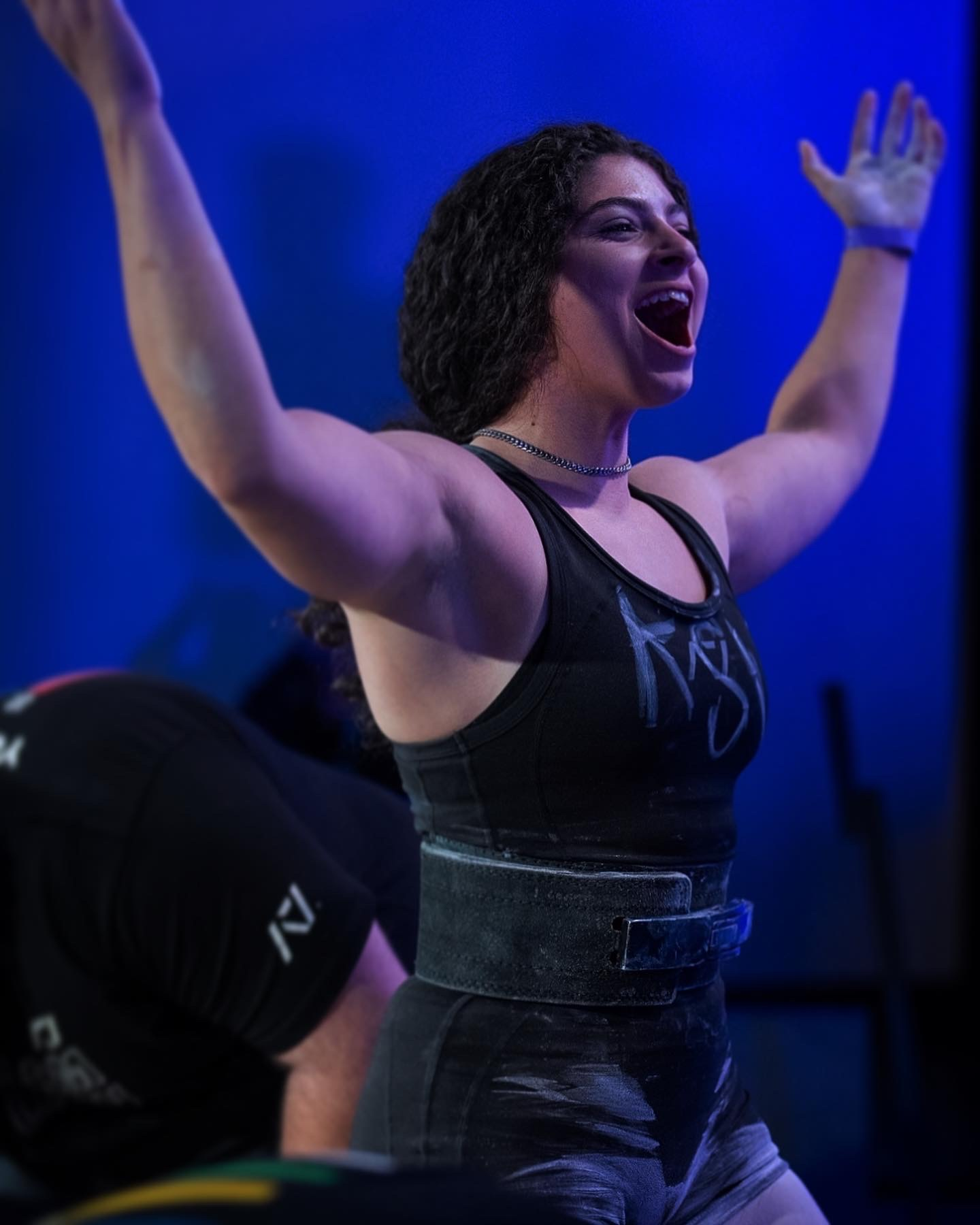 Carinne celebrating after a weightlifting attempt